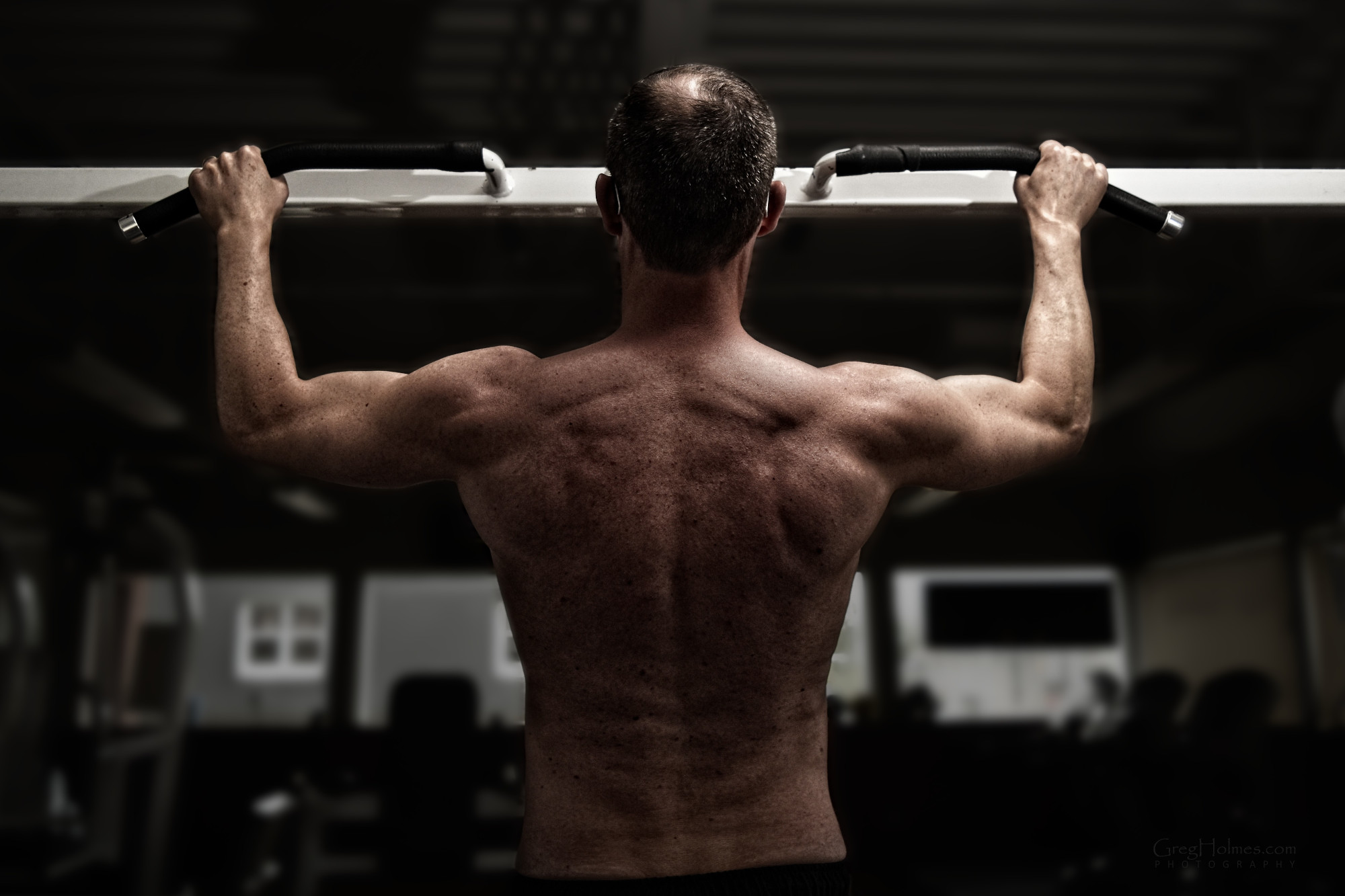 Male, shirtless, in gym, wide-grip pull-up